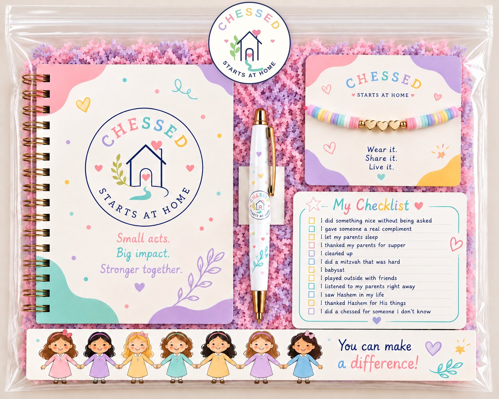 The Chessed Starts at Home kit: spiral journal, logo sticker, pen, beaded bracelet, My Checklist card and a bookmark of girls holding hands